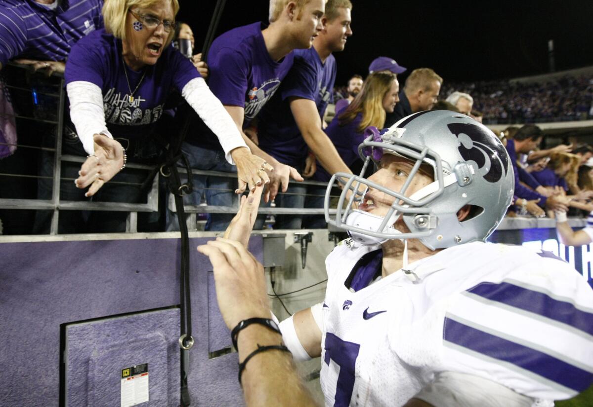 Kansas State quarterback Collin Klein celebrates with fans after a 23-10 victory over Texas Christian on Saturday.