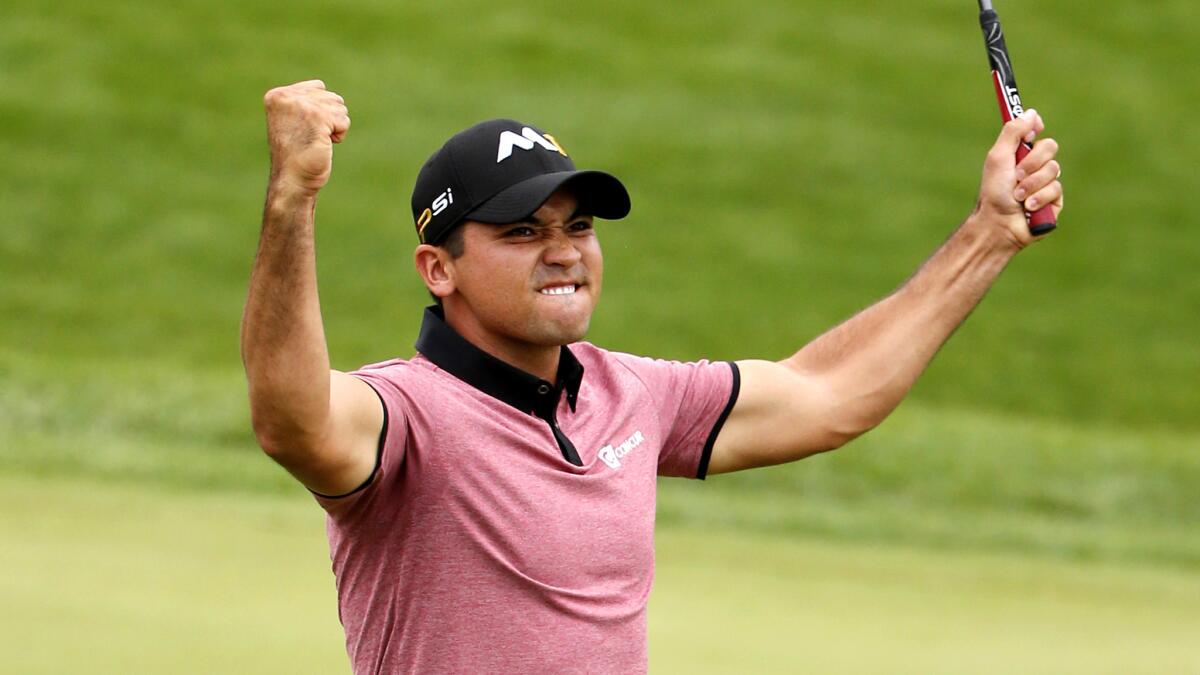 Jason Day celebrates after making an eagle putt at No. 18 on Friday during the second round of the BMW Championship.