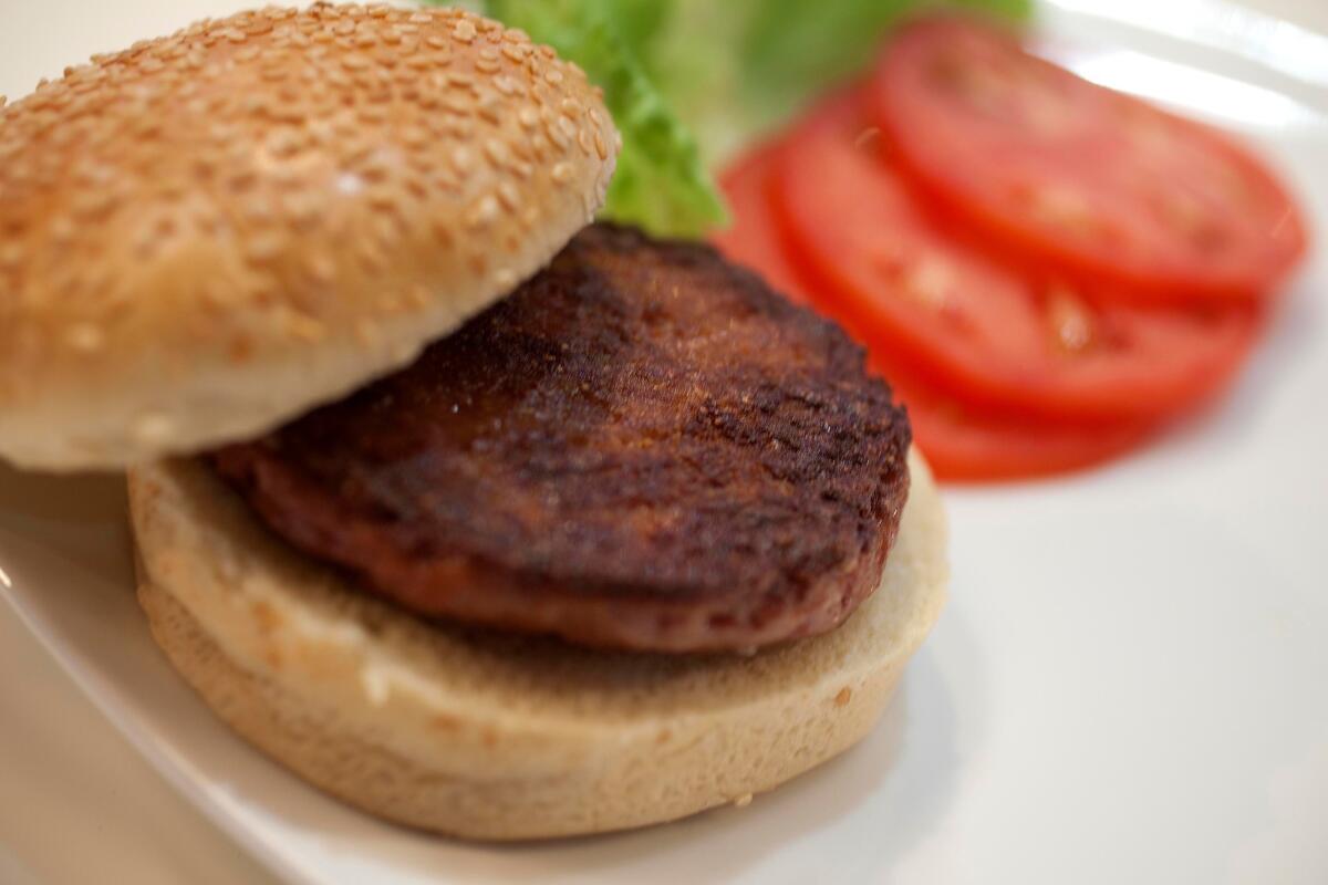 The world's first lab-grown beef burger is displayed in London on Monday.