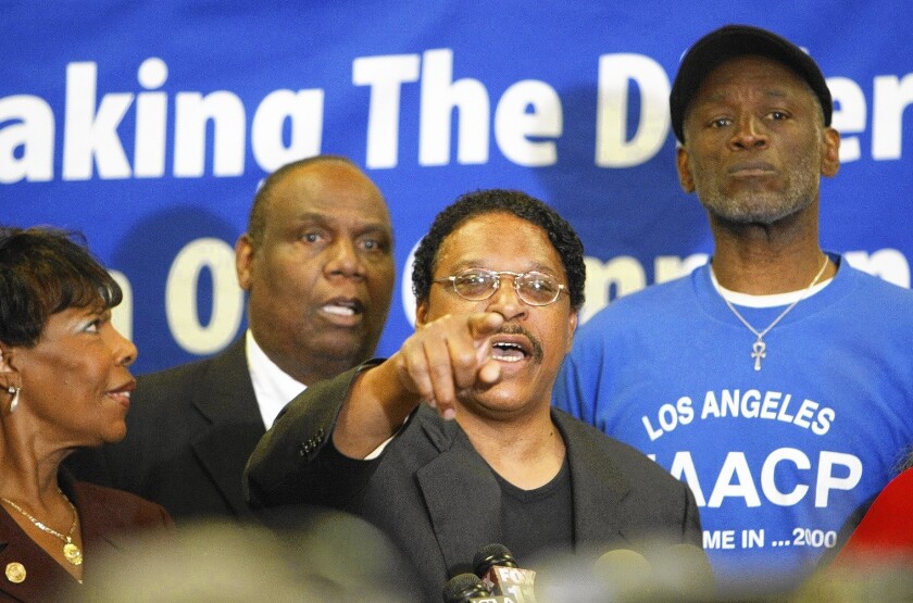 Leon Jenkins, center, then head of the L.A. chapter of NAACP, backed oil drilling in Carson by Occidental Petroleum, which had given the NAACP $9,000.