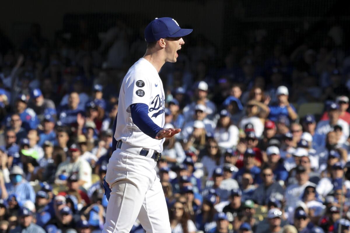 Dodgers starting pitcher Walker Buehler opens his mouth in front of a crowd