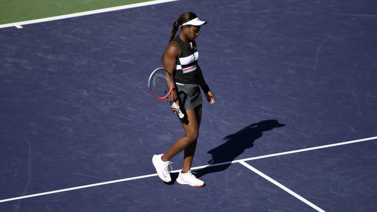 Sloane Stephens walks off the court after getting eliminated by Stefanie Voegele.