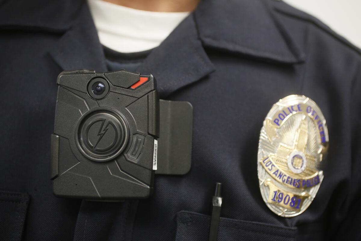 A Los Angeles Police officer wears a body camera during a demonstration for media.