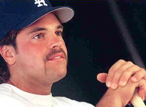 A fresh-faced Mike Piazza talks to media members during spring training in 1998.