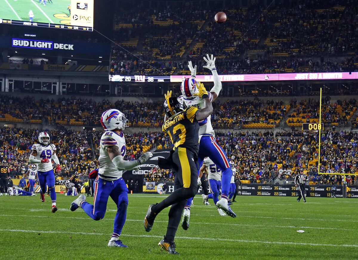 Buffalo Bills cornerback Levi Wallace intercepts a pass intended for Pittsburgh Steelers wide receiver James Washington.