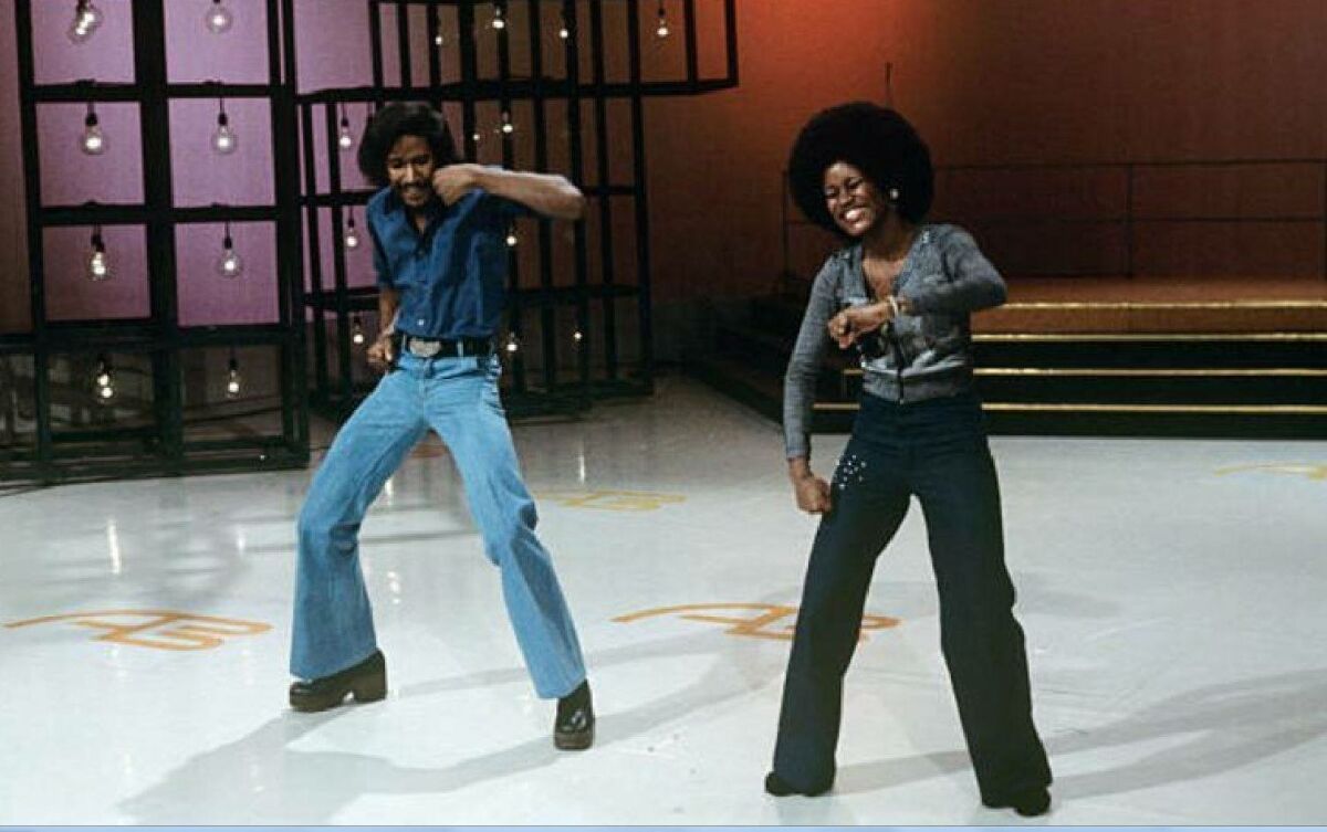 Tyrone Proctor, left, and dance partner Sharon Hill on the dance floor.