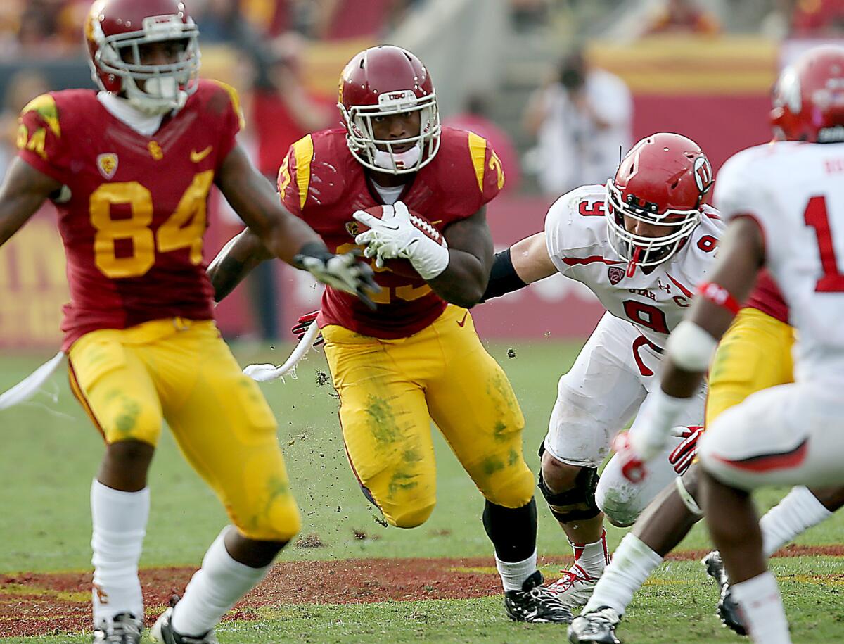 USC tailback Tre Madden, center, shown last October, hasn't been able to play all season due to a toe injury.