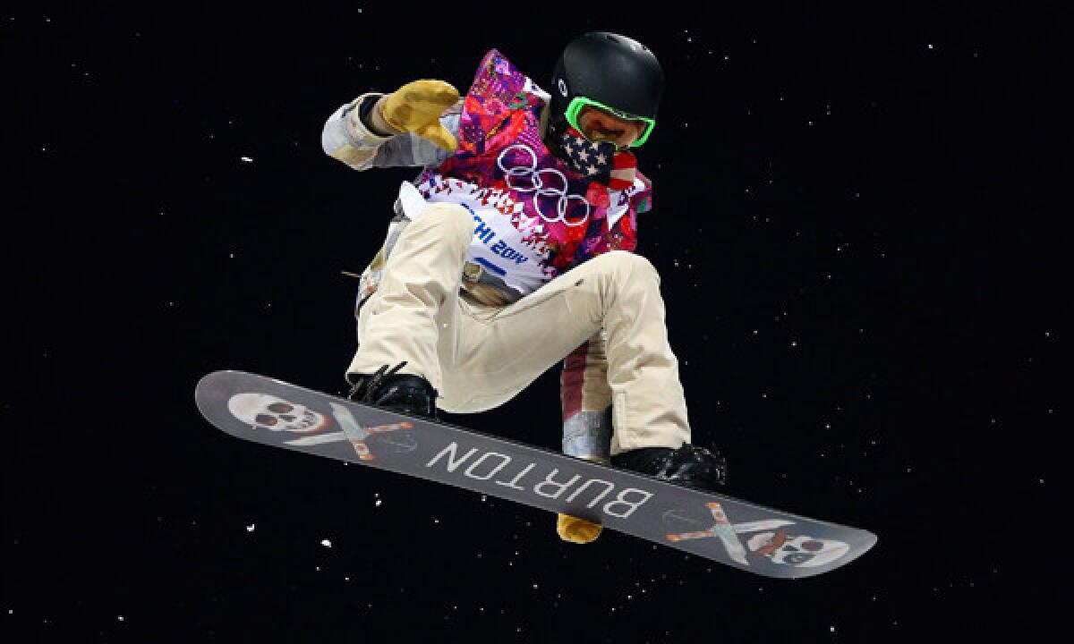 American Shaun White trains on the snowboard halfpipe in preparation for Tuesday's event at Rosa Khutor Extreme Park at the 2014 Sochi Winter Olympic Games.