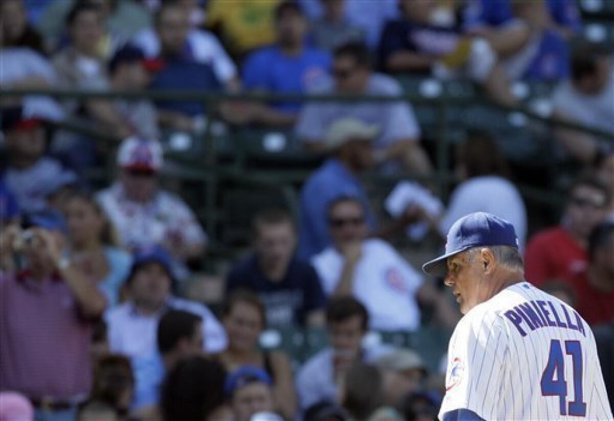 Chicago Cubs manager Lou Piniella walks the dugout during the