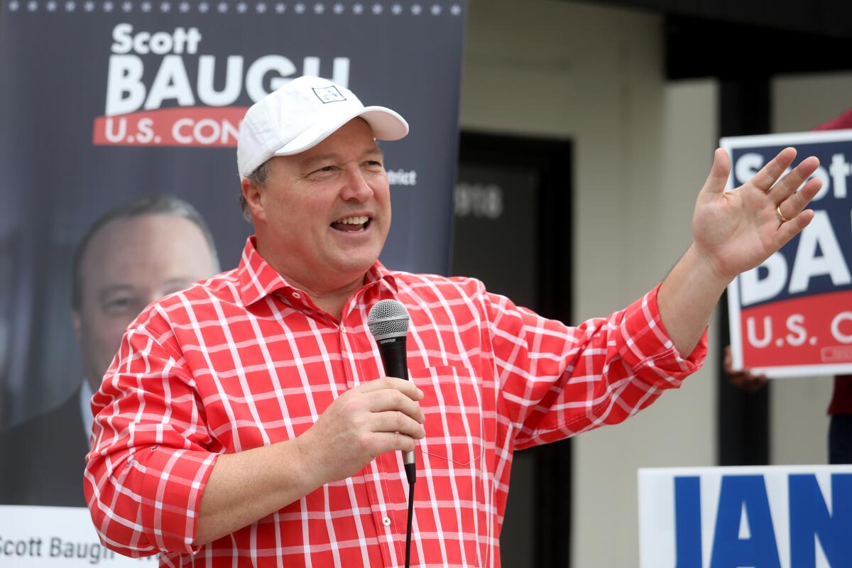 Scott Baugh speaking into a microphone at a campaign event