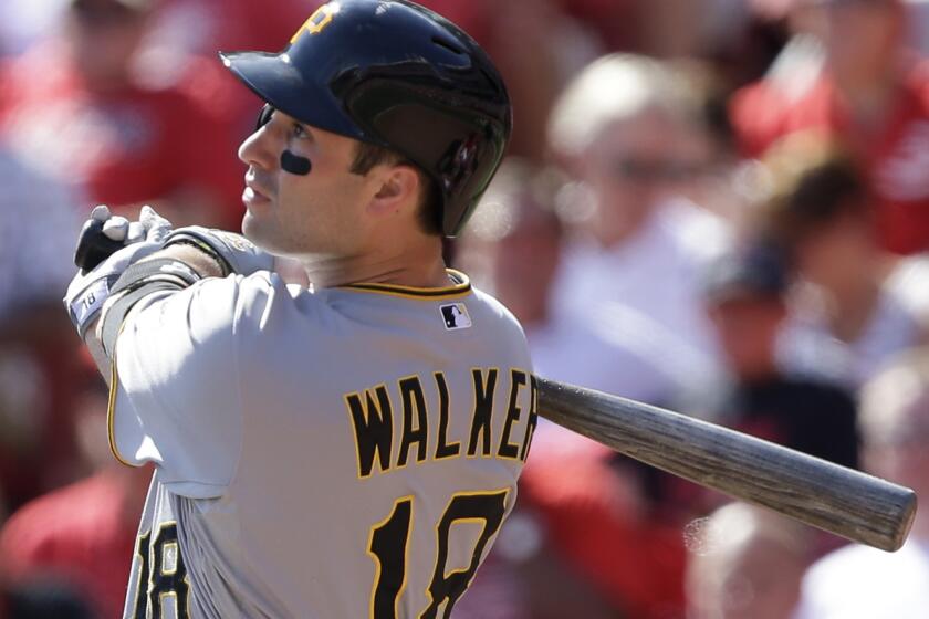 Pirates second baseman Neil Walker hits a solo home run off in 2013.