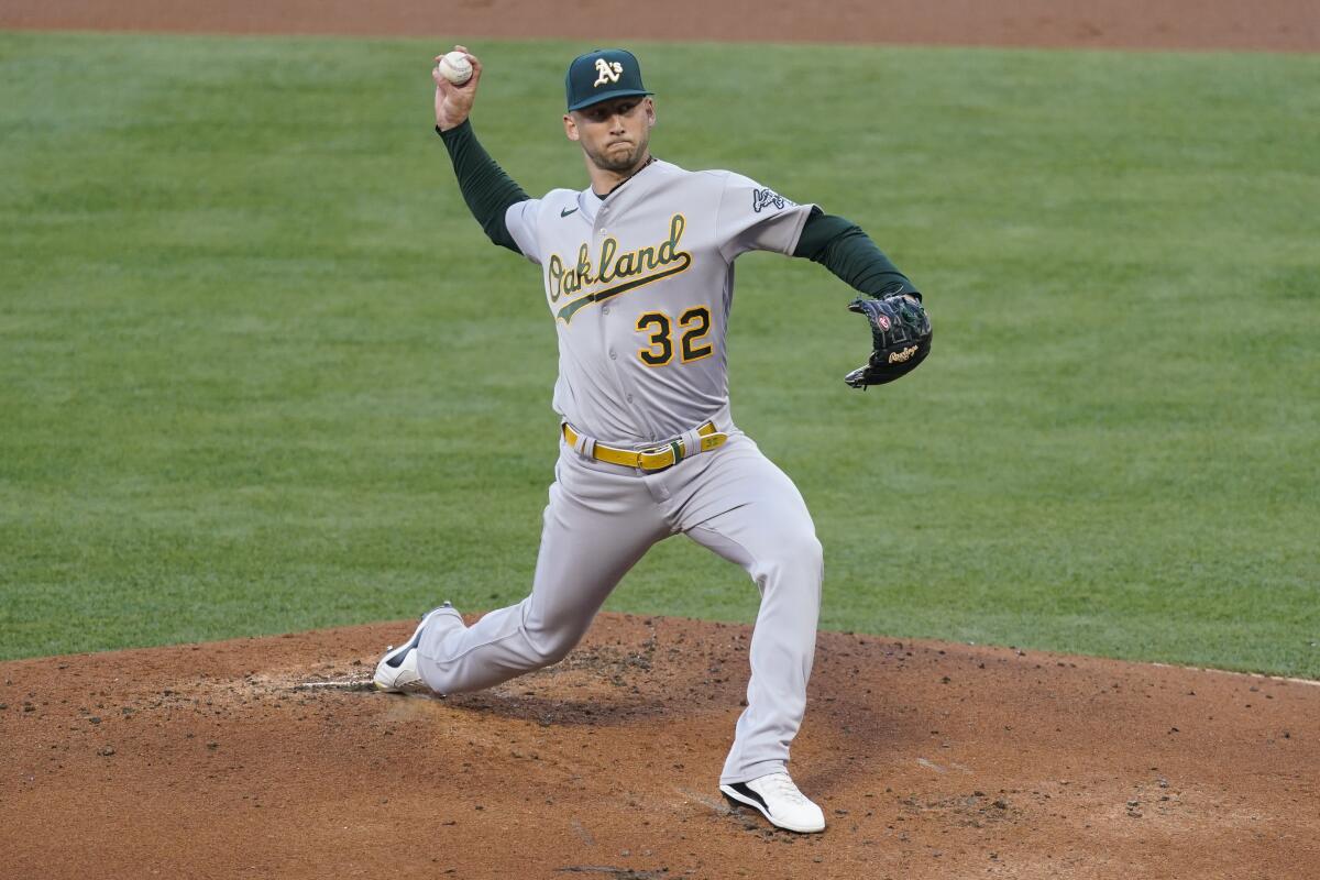 Oakland Athletics starting pitcher James Kaprielian delivers against the Angels on Friday.