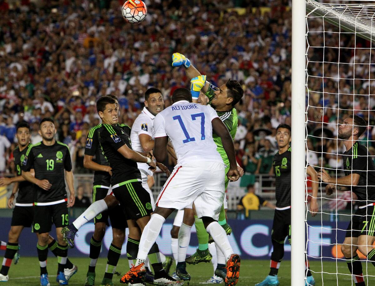 Mexico goalkeeper Alfredo Talavera punches out a shot attempt from the U.S. during the the second half of the CONCACAF Cup game at the Rose Bowl.