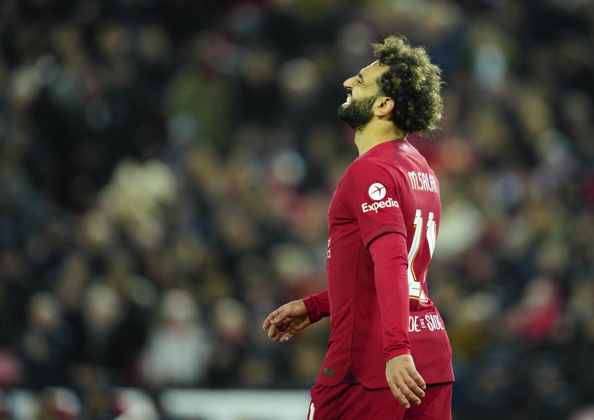 Liverpool's Mohamed Salah reacts during the Champions League Group A soccer match between Liverpool and Napoli, at Anfield stadium in Liverpool, England, Tuesday, Nov. 1, 2022. (AP Photo/Jon Super)