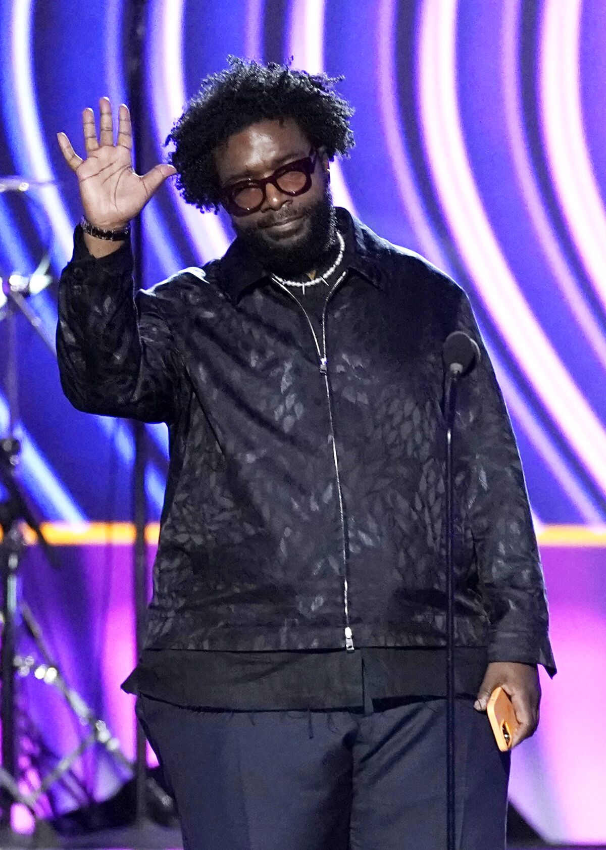 Questlove, appears on stage to accept the best music film album for "Summer Of Soul."