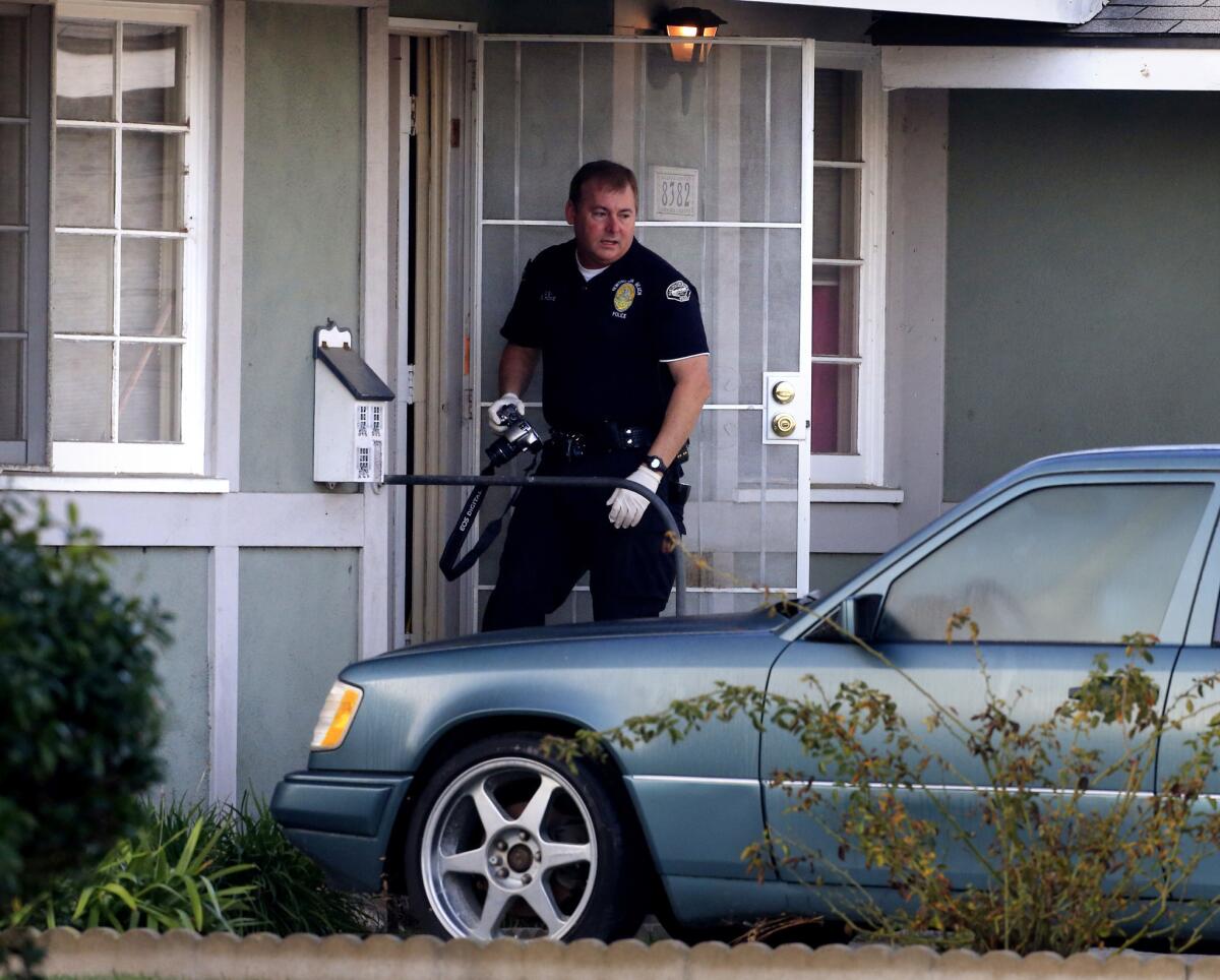 Police investigate the shooting of a man in his home in Huntington Beach.