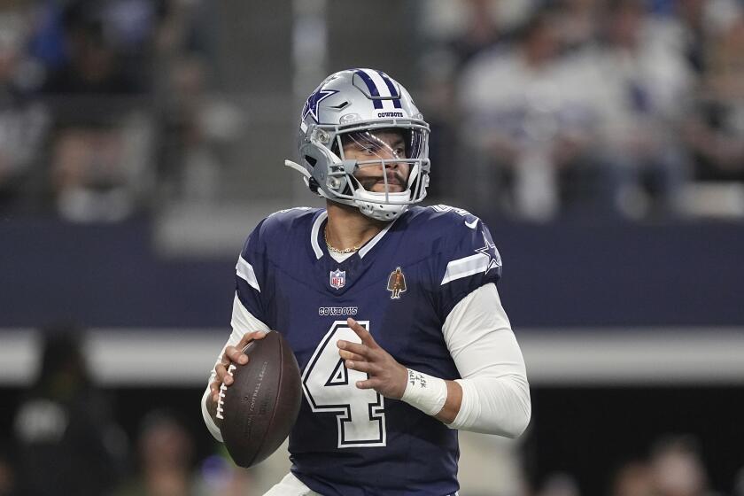 Dallas Cowboys quarterback Dak Prescott looks to pass during the game against the Detroit Lions, Saturday, Dec. 30, 2023, in Arlington, Texas. (AP Photo/Sam Hodde)