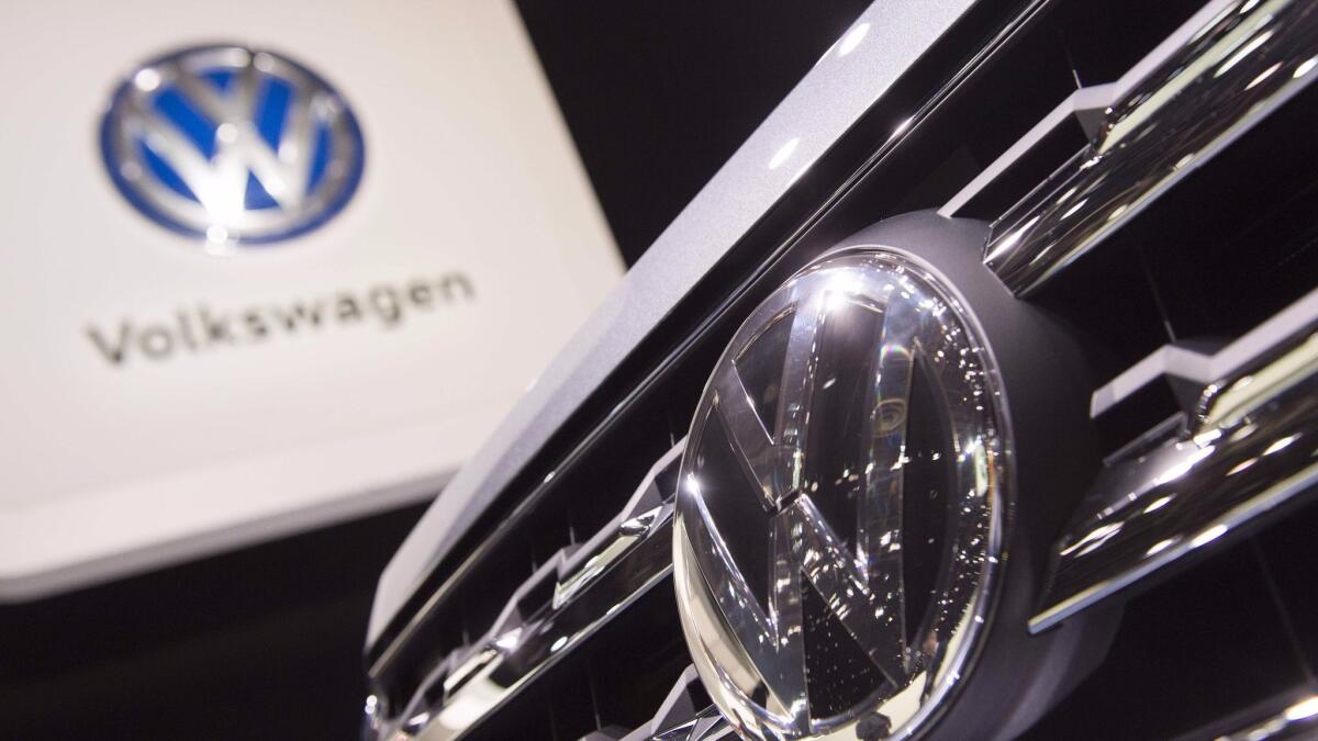 Volkswagen AG, shown here at a global car show in Detroit, will plead guilty to three criminal charges and pay a total $4.3 billion in fines to settle the emissions cheating scandal known as "dieselgate," the US Justice Department announced Wednesday.