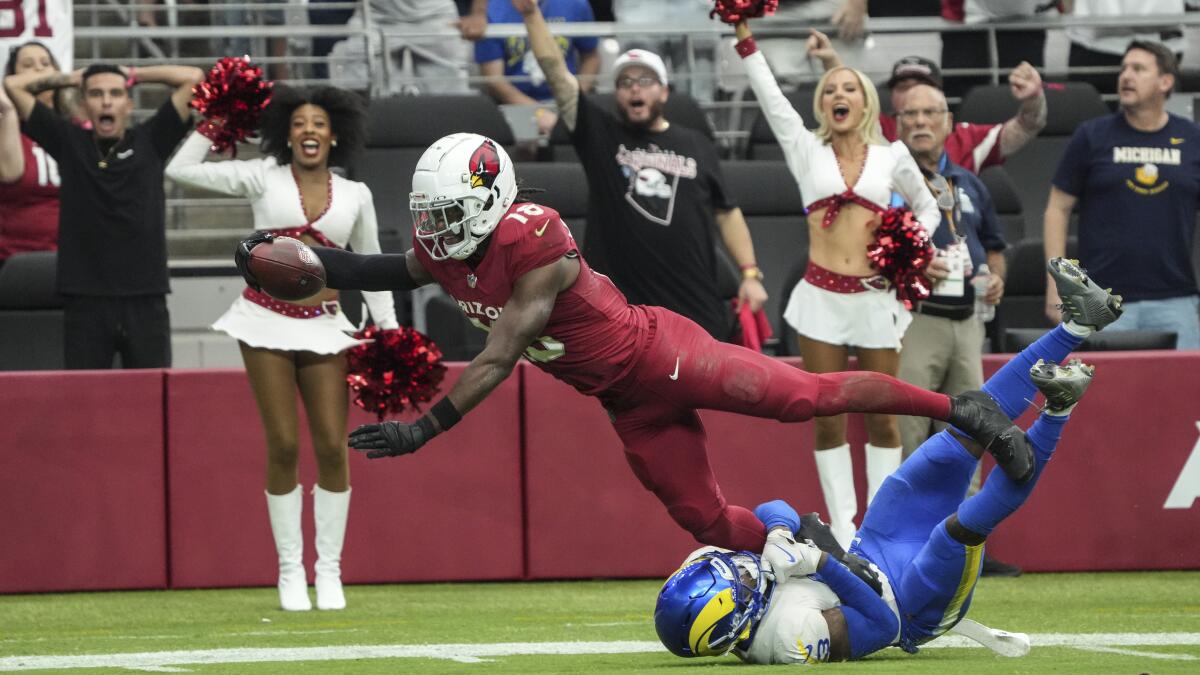 Arizona Cardinals wide receiver Marvin Harrison Jr. dives to score on a touchdown reception against the Rams.