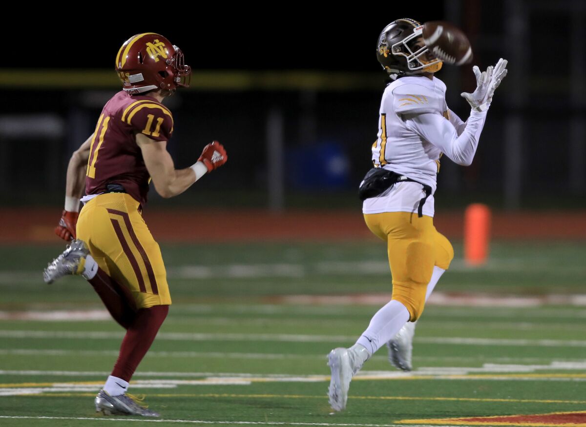 El Camino's Jacob Gathright hauls in a TD pass in last season's 3-AA CIF football championship game, won by Cardinal Newman.