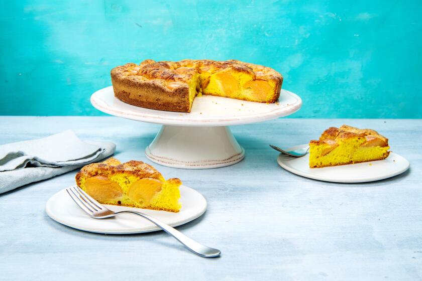 Ripe persimmons dot a simple butter cake, spiced with turmeric and ginger, in this California spin on Marian Burros’ classic plum torte. Prop styling by Nidia Cueva.