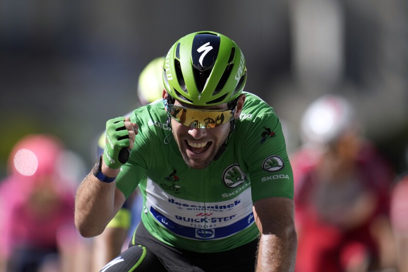 Britain's Mark Cavendish, wearing the best sprinter's green jersey, celebrates as he crosses the finish line to win the thirteenth stage of the Tour de France cycling race over 219.9 kilometers (136.6 miles) with start in Nimes and finish in Carcassonne, France, Friday, July 9, 2021. (AP Photo/Christophe Ena)