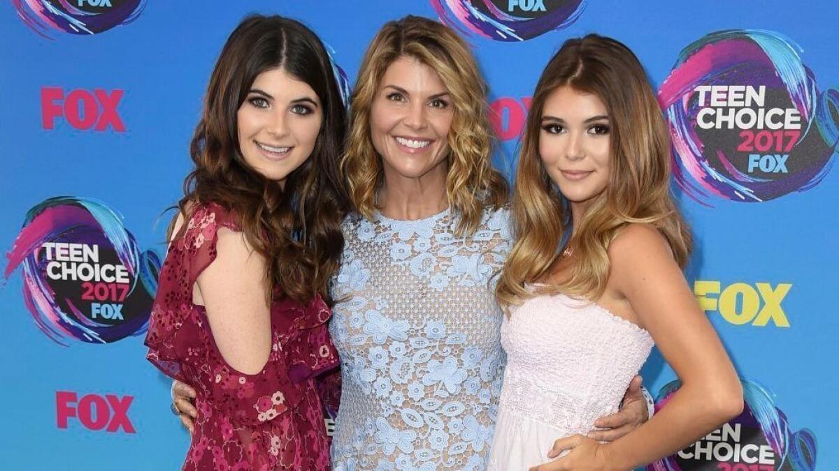 Actress Lori Loughlin, center, with her daughters Bella, left, and Olivia Jade at the Teen Choice Awards in Los Angeles.