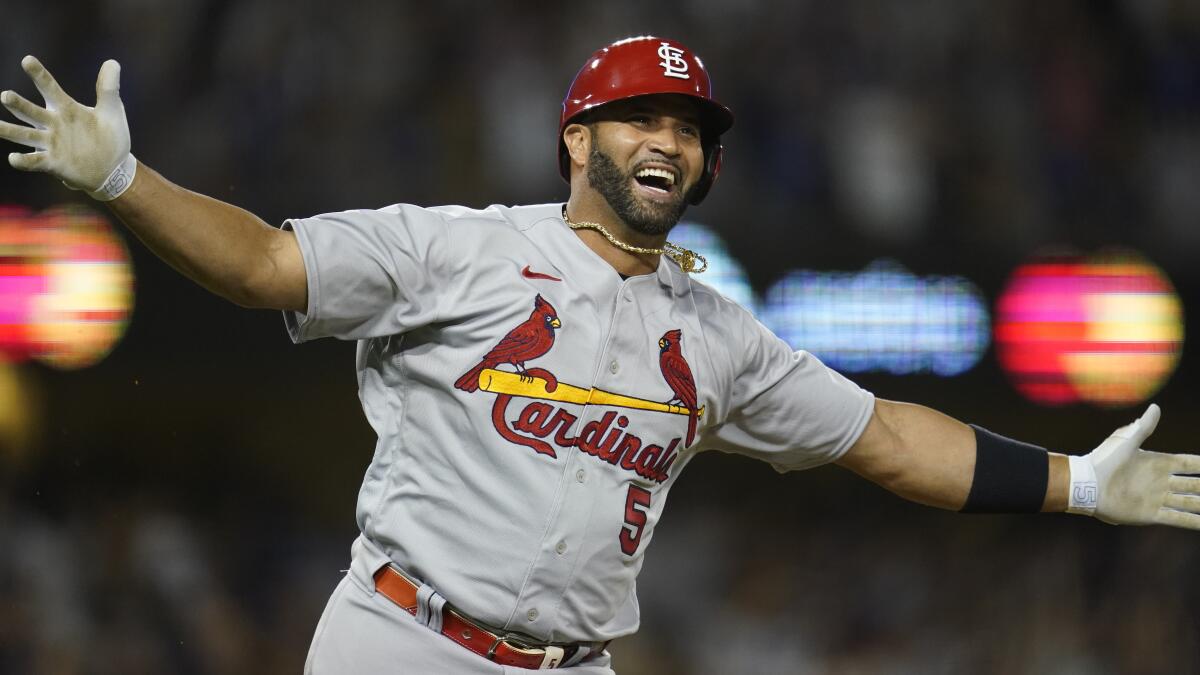 Cardinals designated hitter Albert Pujols celebrates after hitting his 700th career home run on Sept. 23 against the Dodgers.