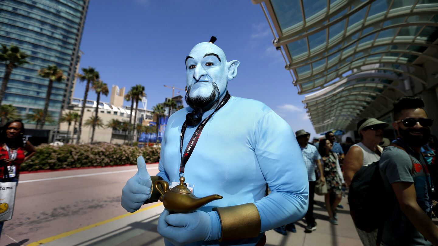 Fans dress up as their favorite characters Saturday at Comic-Con 2017.