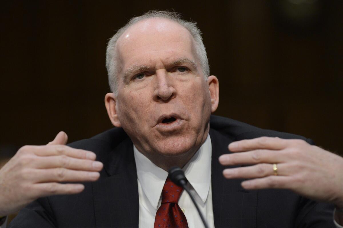 John Brennan gestures while appearing before the Senate Intelligence Committee hearing on his nomination to be director of the Central Intelligence Agency in Washington D.C. Brennan's nomination has raised concern among some members of Congress regarding his involvement in the policy planning of drone attacks.