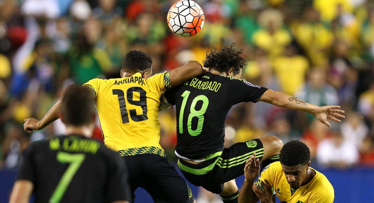 PHILADELPHIA, PA - JULY 26: Adrian Mariappa #19 of Jamaica and Andres Guardado #18 of Mexico battle for a head ball in the first half during the CONCACAF Gold Cup Final at Lincoln Financial Field on July 26, 2015 in Philadelphia, Pennsylvania. Mexico won, 3-1. (Photo by Patrick Smith/Getty Images) ** OUTS - ELSENT, FPG - OUTS * NM, PH, VA if sourced by CT, LA or MoD **