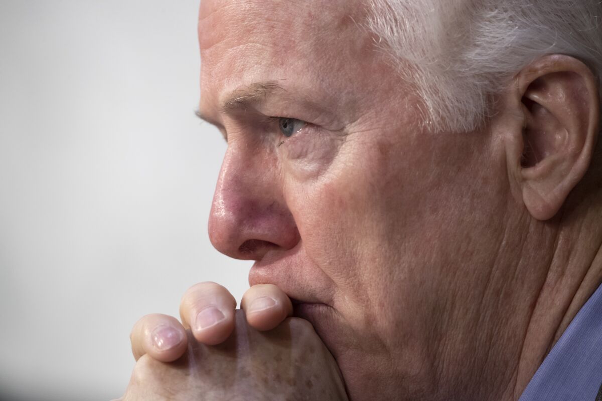 FILE - Sen. John Cornyn, R-Texas, listens to testimony during a Senate Intelligence Committee hearing on Capitol Hill