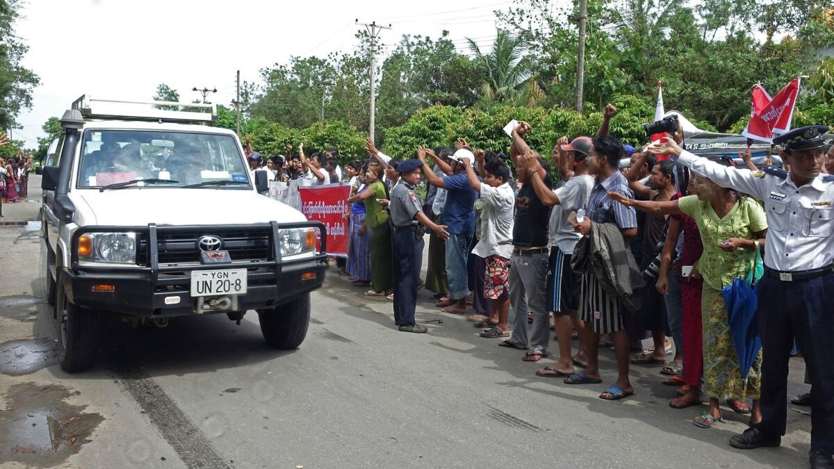 Demonstrators protest as the motorcade of Yanghee Lee, U.N. Special Rapporteur on Human Rights, passes through Sittwe, Myanmar on July 12.