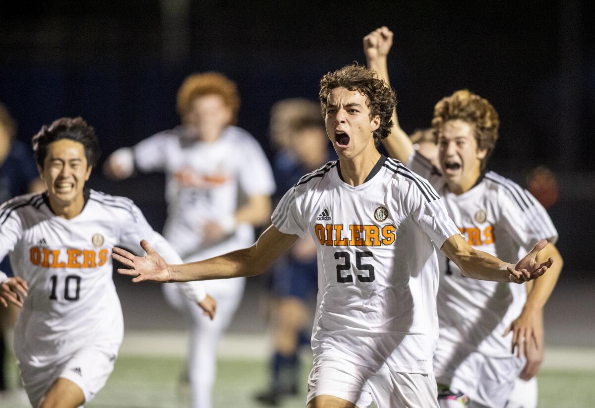 Huntington Beach's Grant James (25) celebrates after scoring a goal against Newport Harbor.  