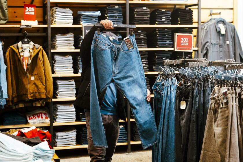 A shopper looks at jeans inside a Levi's store in New York.