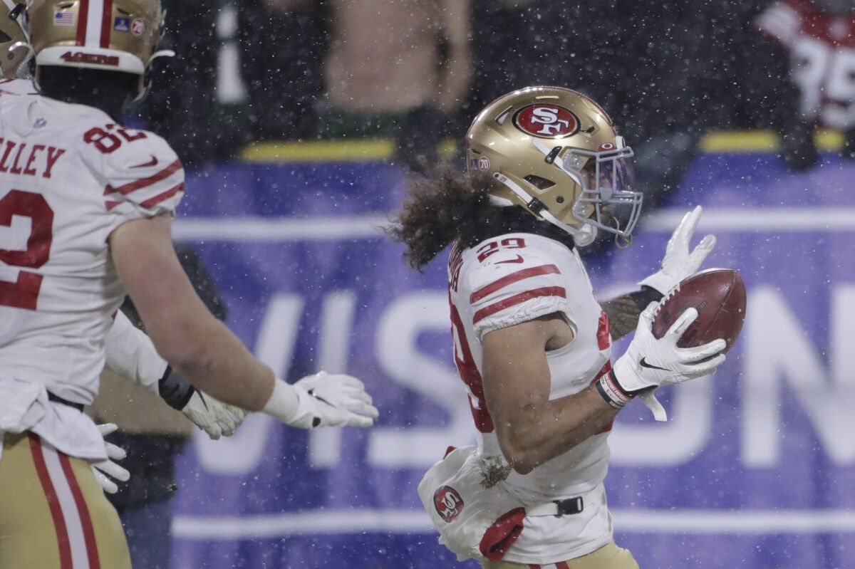 San Francisco's Talanoa Hufanga returns a blocked punt six yards for a touchdown with 4:41 left to tie the score.