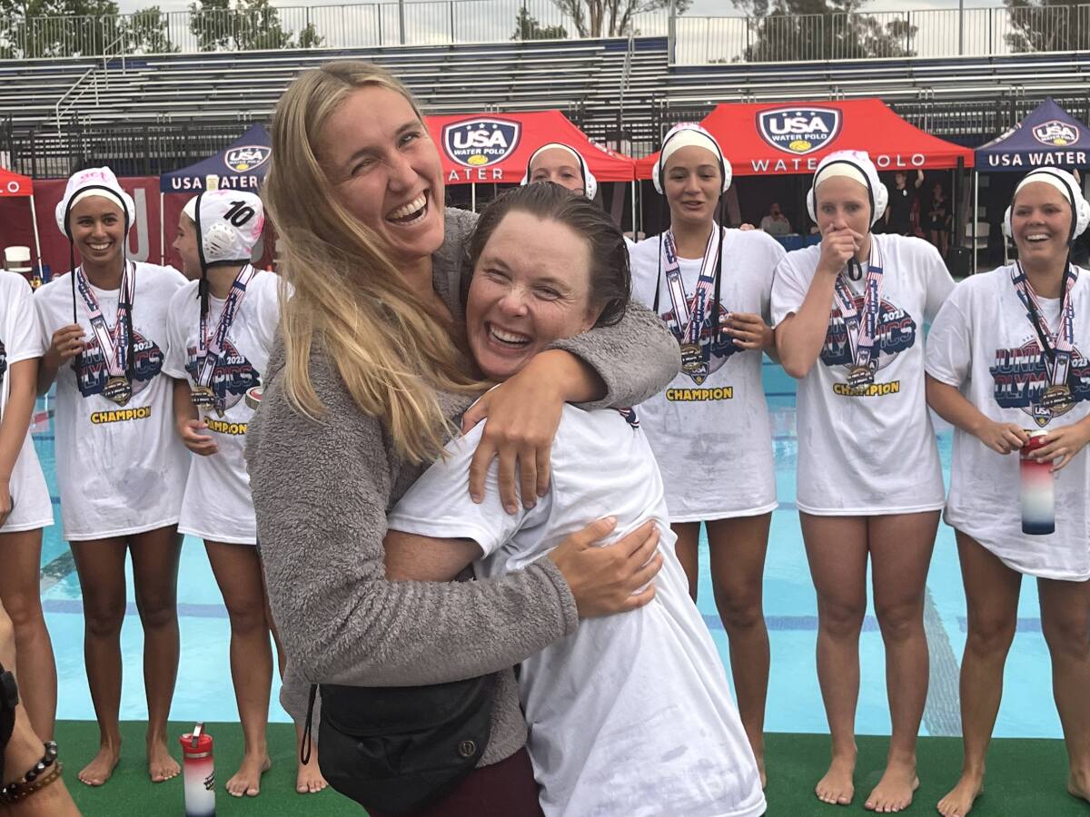 Former Laguna Beach girls' water polo teammates Aria Fischer and Claire Sonne embrace after SET won the 18U gold medal.