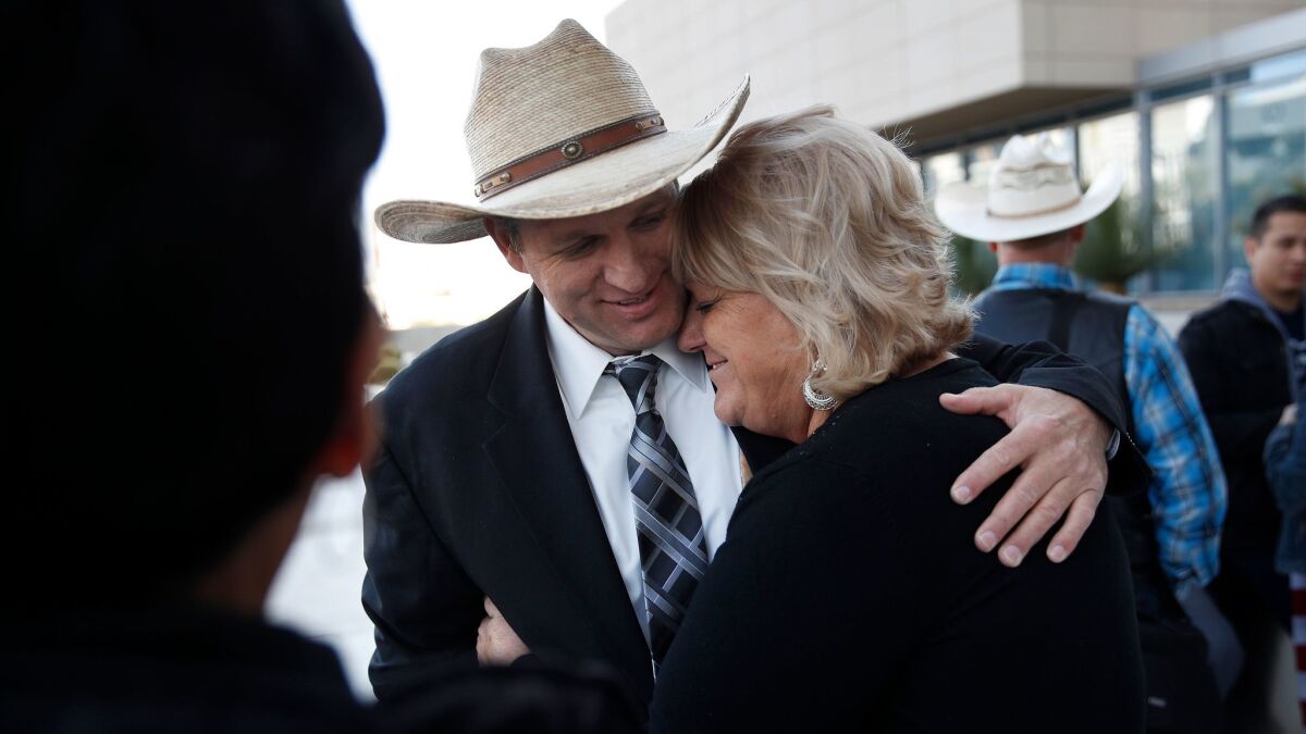 Ammon Bundy, left, hugs his aunt Lillie Spencer outside a federal courthouse in Las Vegas after a judge declared a mistrial in the case against him.