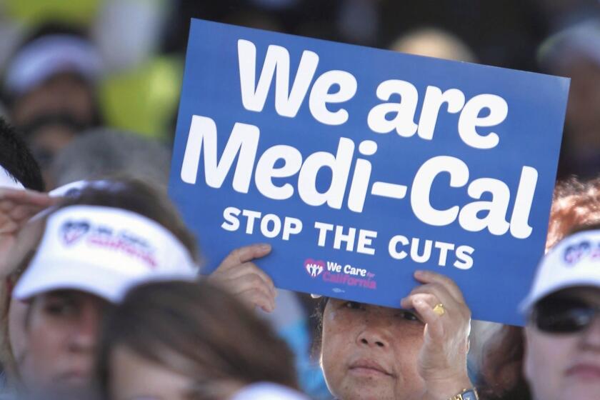 FILE - In this June 4, 2013, file photo, sign-carrying demonstrators representing doctors, hospitals and unionized health care workers rally against cuts in the amount the state pays for Medi-Cal reimbursements, at the Capitol in Sacramento, Calif. Lawmakers will return to the Capitol on Monday, Jan. 4, 2016, facing two unresolved problems from 2015: A $1 billion hole in funding the state's health care program and a $59 billion backlog in road repairs needed over the next decade. Gov. Jerry Brown called special sessions in 2015 to address both issues, but he and lawmakers never reached a deal on paying for either. (AP Photo/Rich Pedroncelli, File)