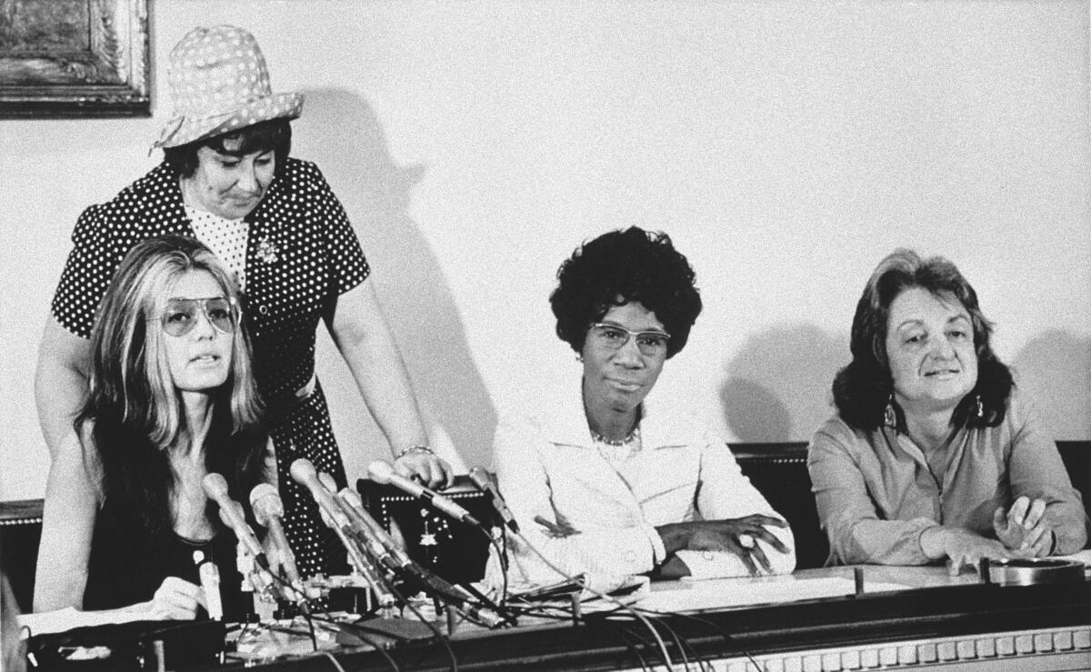 At a Washington news conference on July 12, 1971, members of the National Women's Political Caucus state that one of their goals is for women to comprise half of the delegates to the 1972 presidential conventions. Seated from left: Gloria Steinem, Rep. Shirley Chisholm (D-N.Y.) and Betty Friedan. Standing is Rep. Bella Abzug (D-N.Y.).