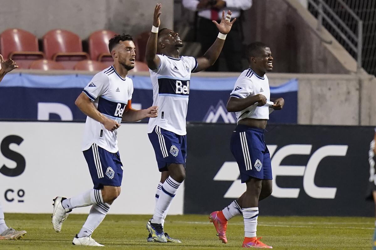 Vancouver's Cristian Dajome, center, celebrates his goal against the Galaxy during the second half July 17, 2021.