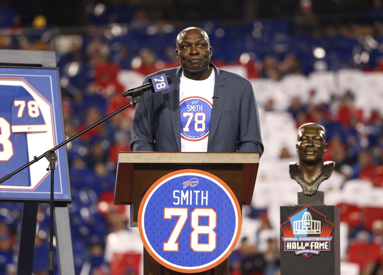 Hall of Famer Bruce Smith, a former Buffalo Bill, speaks after his jersey number was retired during halftime an NFL football game between the Bills and the New York Jets on Thursday, Sept. 15, 2016, in Orchard Park, N.Y. (AP Photo/Bill Wippert)