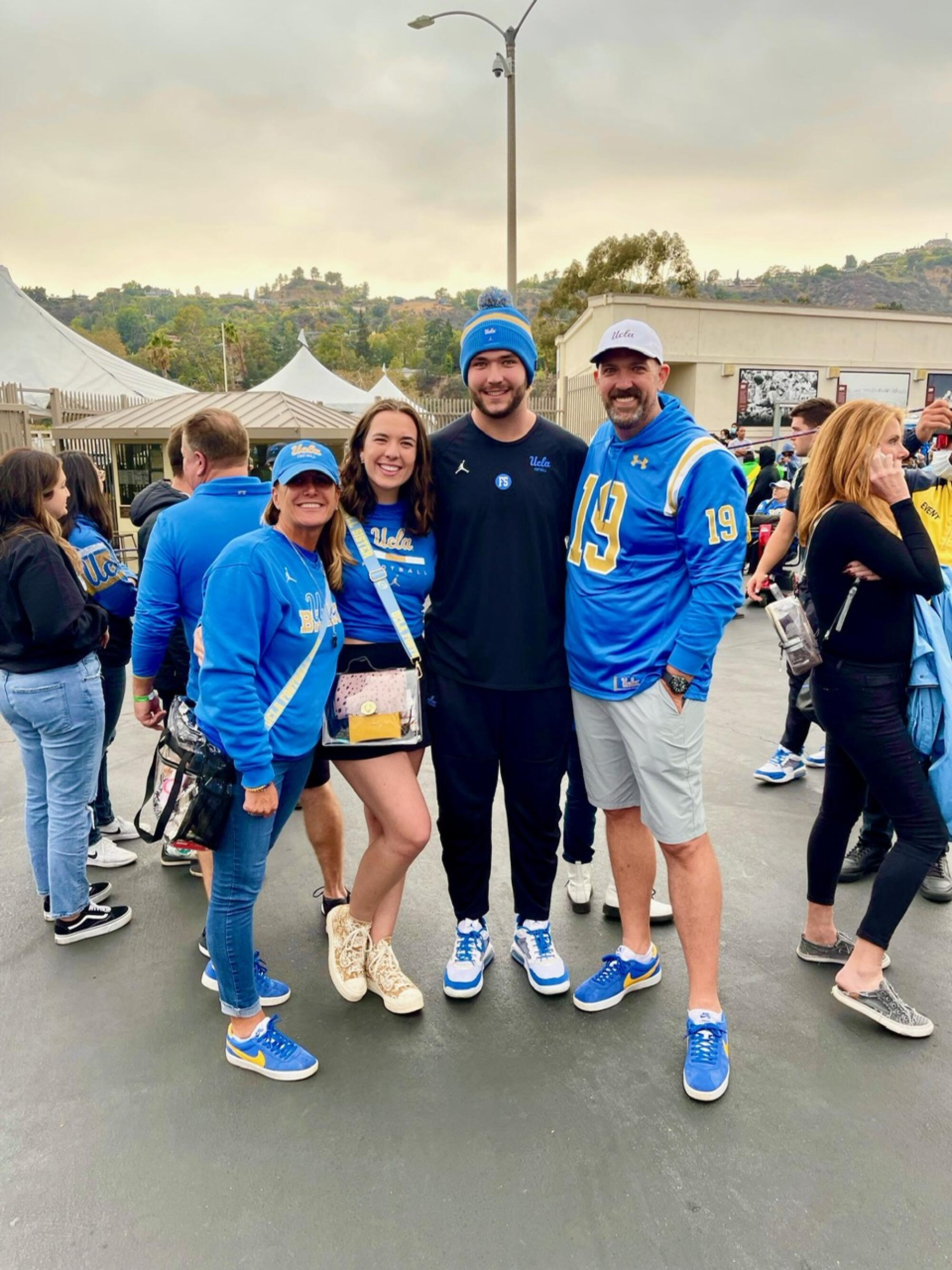 UCLA football player Thomas Cole is joined by his mother, Kelli; sister, Katie; and father David.