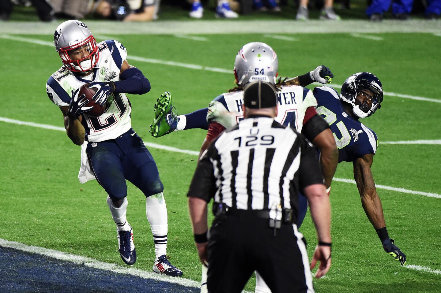Malcolm Butler #21 of the New England Patriots makes an interception against the Seattle Seahawks in the fourth quarter during Super Bowl XLIX at University of Phoenix Stadium on February 1, 2015 in Glendale, Arizona.