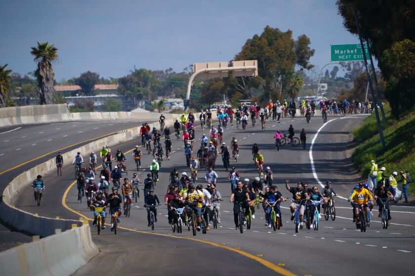Riders enjoy a trip down Interstate 15 between Market Street and Main Street on Saturday, March 25, 2023. The event hosted by Caltrans coincided with work crews performing routine scheduled maintenance on the highway.