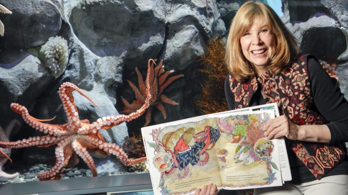 Children's author Jan Brett hangs out with Gilligan, a giant Pacific octopus.