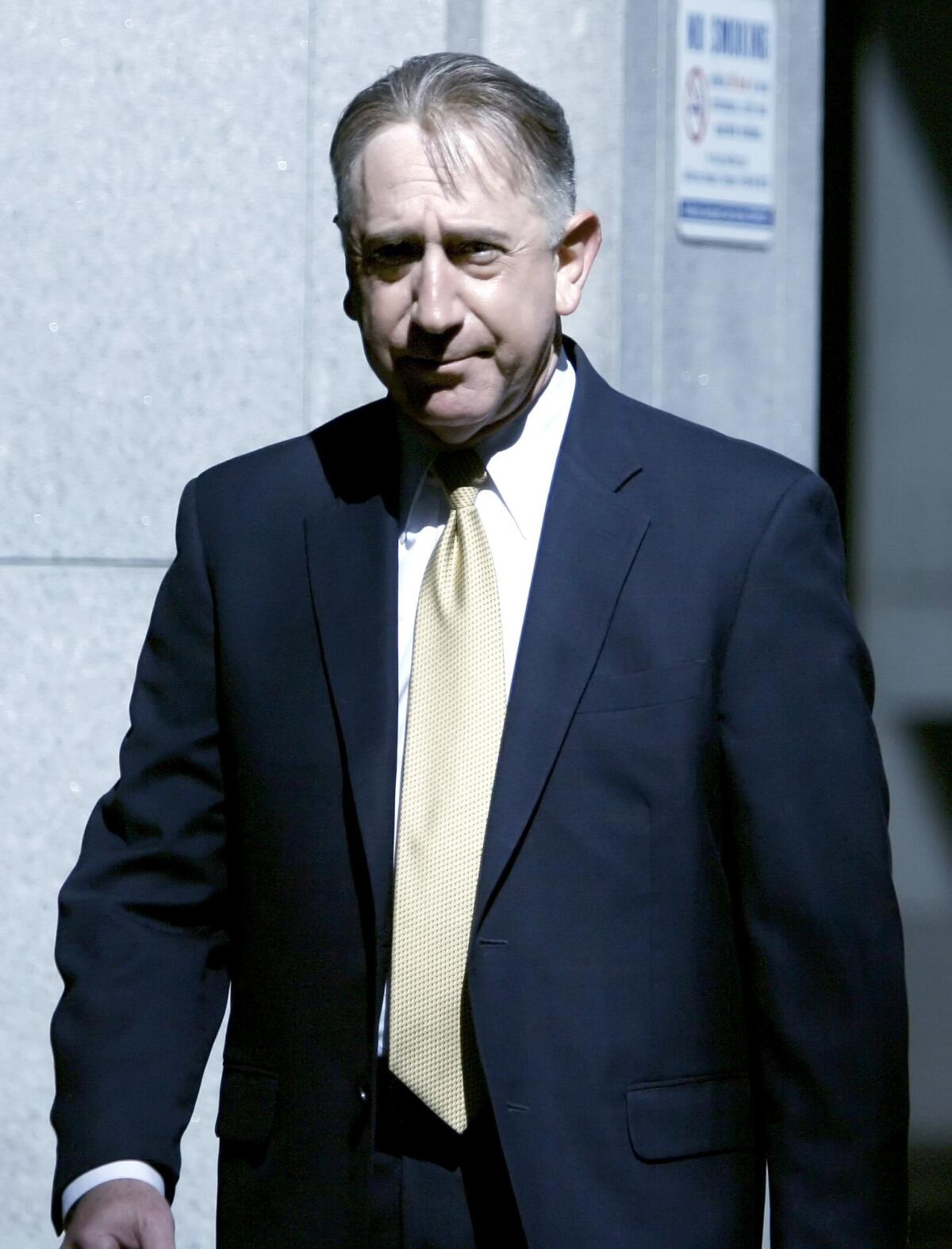 Former Glendale city councilmember John Drayman arrives at the C. S. Foltz Criminal Justice Center in Los Angeles to be arraigned on charges on Tuesday, May 8, 2012.