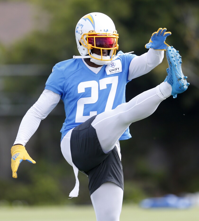 Chargers cornerback JC Jackson loosens up before practice.