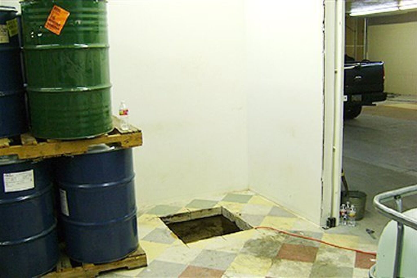 In this undated photo provided by the United States Drug Enforcement Administration, shows floor shaft entrance from a storage room that was a 240-yard, a complete and fully operational drug smuggling tunnel that ran from a small business in Arizona to an ice plant on the Mexico side of the border,