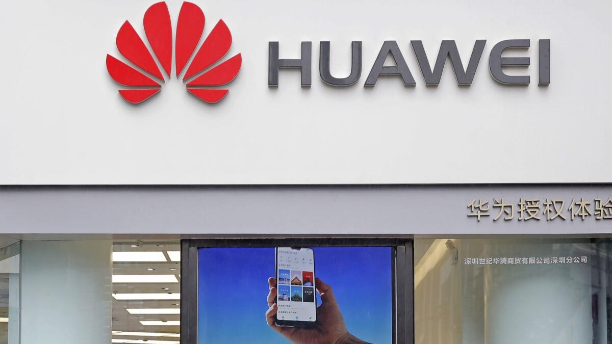 A Huawei logo is displayed at a shop in Shenzhen, China, on Thursday.
